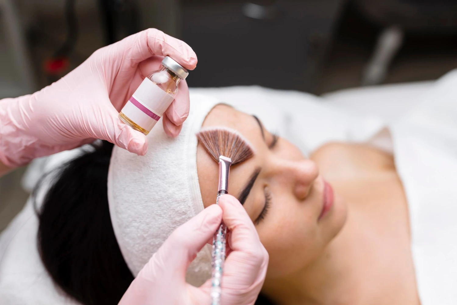 Lady undergoing Chemical Peel treatment at clinic.