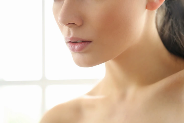 Close up view of a lady with a nice and full looking chin from fillers.